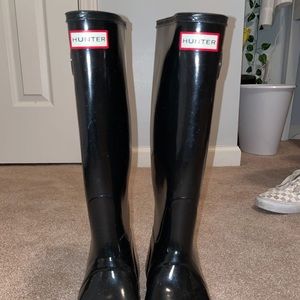 Tall black hunter boots